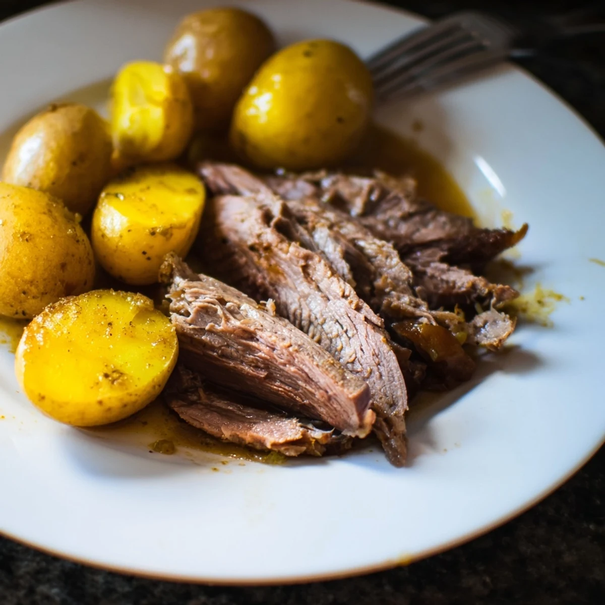 Tender slow cooker pot roast, meltingly soft, with delicious potatoes and rich broth.