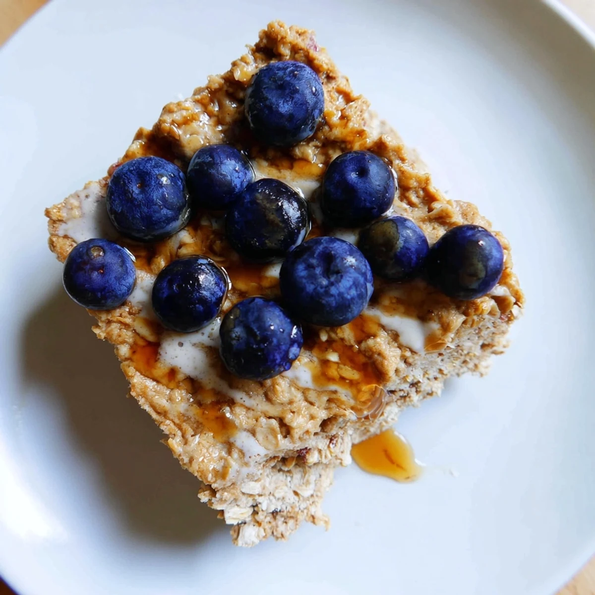 Fluffy Protein Pancake Oats, baked until golden, ready to be sliced and enjoyed for breakfast.