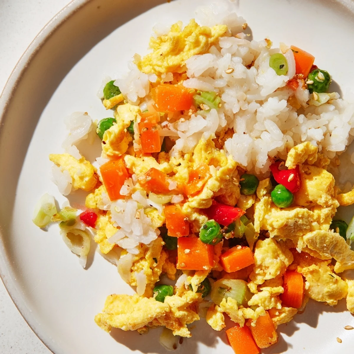 Golden-brown Egg Fried Rice with colorful veggies, ready to serve as a quick weeknight meal.