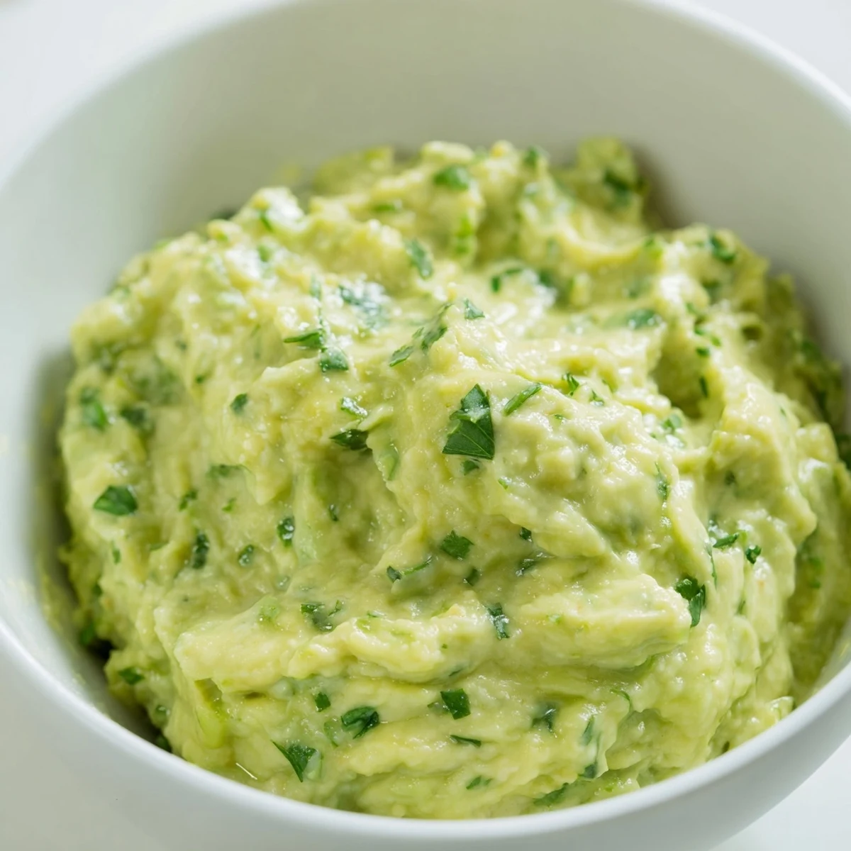 Freshly made Avocado Lime Dip with bright green avocado chunks and a zesty lime aroma.