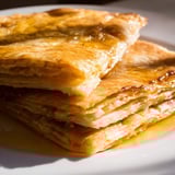 A stack of homemade Moroccan Msemen, showing off the perfectly crisp, layered texture ready to eat.