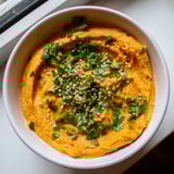 Golden roasted carrots blended with fresh ginger create this creamy Carrot Ginger Dip, perfect for healthy snacking.