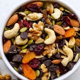 A close-up of Trail Mix Custom with walnuts, pumpkin seeds, dried apricots, and cranberries for a healthy snack.  