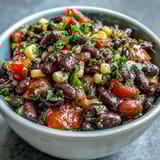 Colorful 3-Ingredient Cowboy Caviar Dip with black beans, corn, and fresh pico de gallo in a serving bowl.