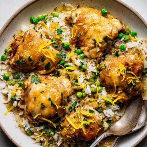 Close-up of One-Pot Creamy Lemon Chicken and Rice, garnished with fresh parsley for a vibrant touch.