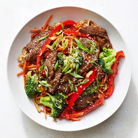 Vibrant photo of savory Easy Beef Stir-Fry with Lo Mein Noodles, showcasing tender beef and fresh vegetables.