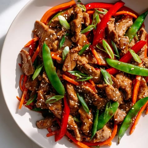 This Sweet Teriyaki Pork Stir-Fry boasts a glistening glaze, with pork and veggies ready to savor.