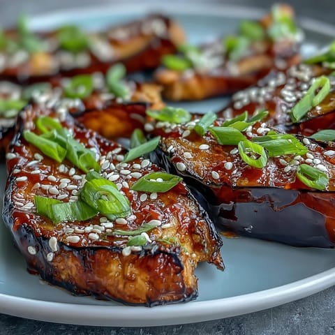 Miso Glazed Eggplant glistening, tender eggplant halves ready to enjoy warm.
