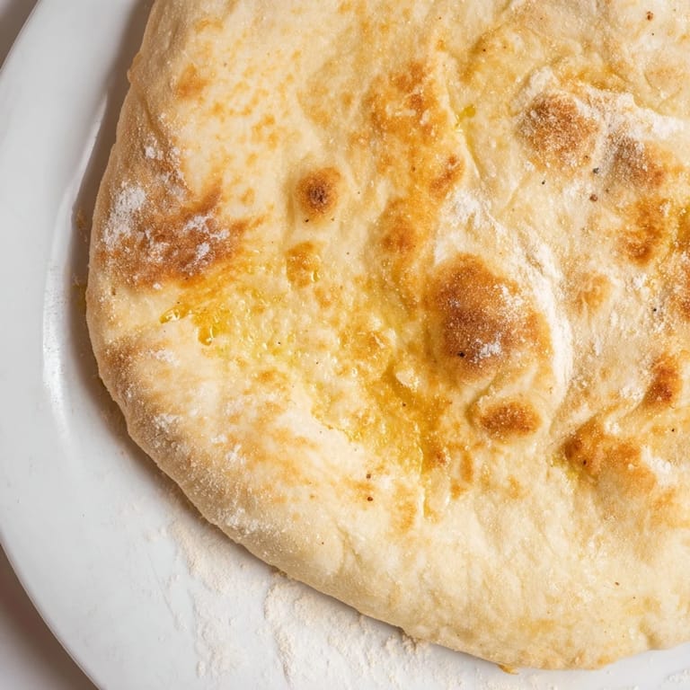 Warm and lightly puffed, these homemade Three-Ingredient Easy Flatbreads are perfect for Mediterranean meals.