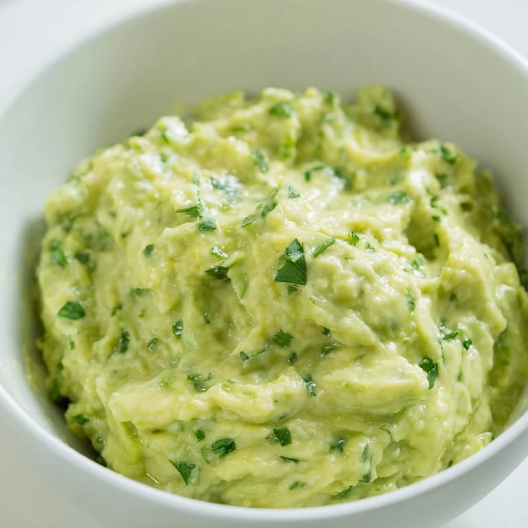 Freshly made Avocado Lime Dip with bright green avocado chunks and a zesty lime aroma.