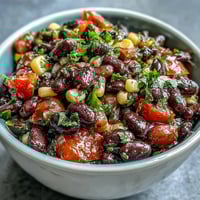 Colorful 3-Ingredient Cowboy Caviar Dip with black beans, corn, and fresh pico de gallo in a serving bowl.